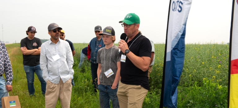 Colin Rosengren speaking at fields at Avena Customer and Farmer Appreciation Day 2024 Tour