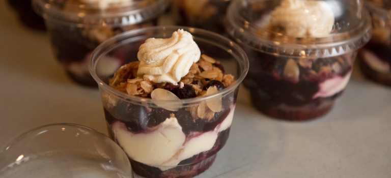 A Saskatoon Berry dessert parfait featuring Avena Purity Protocol gluten-free rolled oats