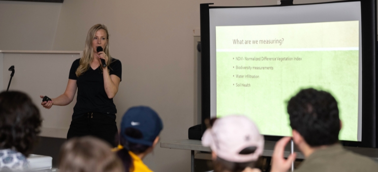 Regan Ferguson presenting at Avena Customer and Farmer Appreciation Day 2024 Tour